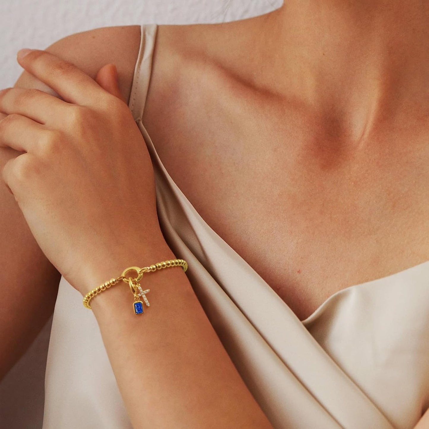 Free bird Cross Birthstone Bracelet | Dainty 14K Gold Plated Cross Charm Bracelet | Stretchable Elastic Gold Beaded Bracelet